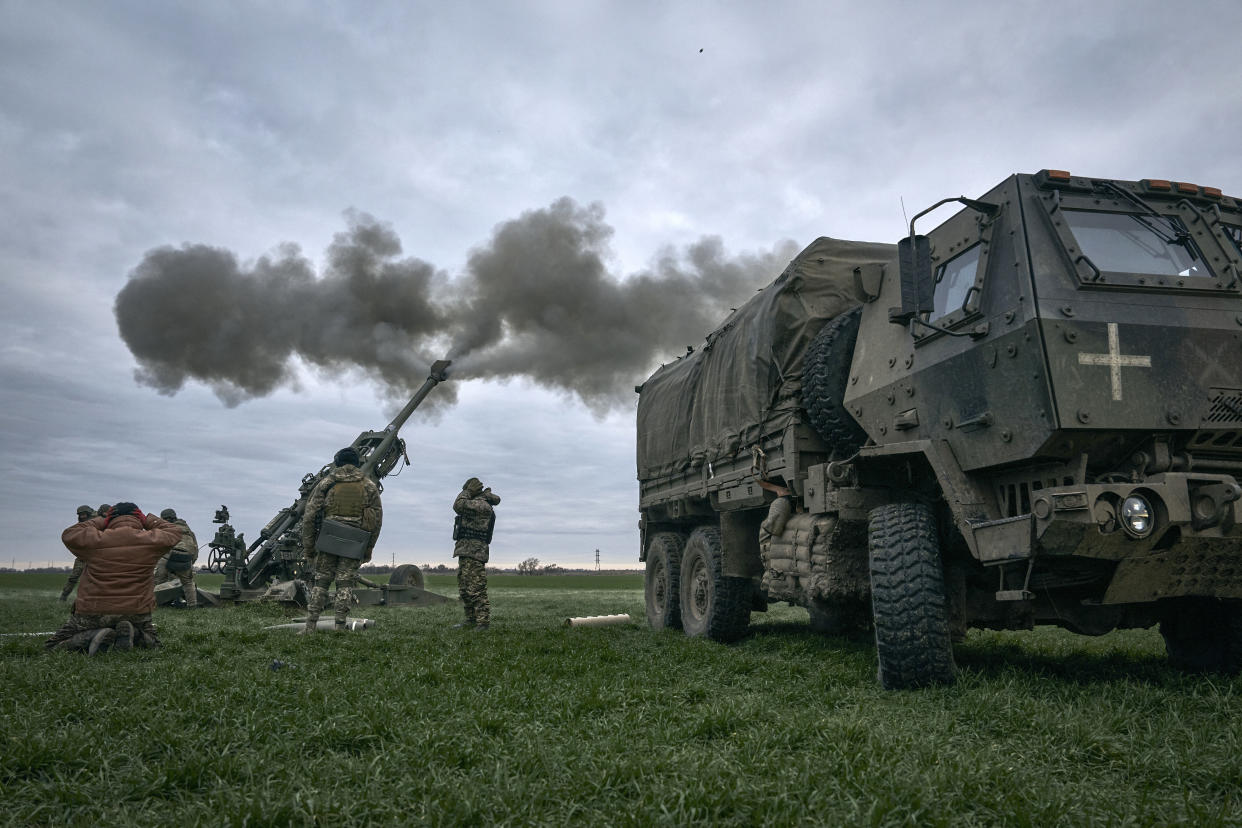 Ukrainian soldiers fire at Russian positions from a U.S.-supplied M777 howitzer in Kherson region, Ukraine, Jan. 9, 2023. (AP Photo/Libkos)