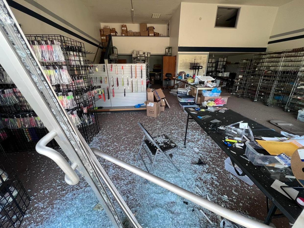 Glass and debris were scattered across DeLong Lures in Canal Fulton after a stolen vehicle crashed through the store early Tuesday morning.