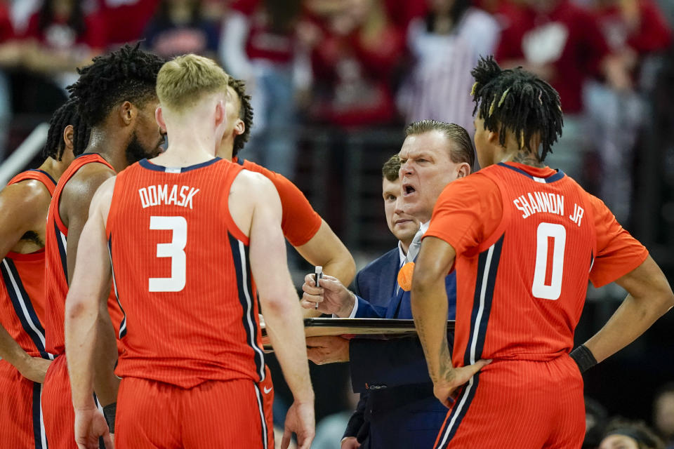 Illinois coach Brad Underwood talks with his team during the second half of an NCAA college basketball game against Wisconsin Saturday, March 2, 2024, in Madison, Wis. (AP Photo/Andy Manis)