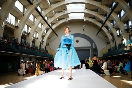 A model presents a creation during the Molly Goddard catwalk show during London Fashion Week in London