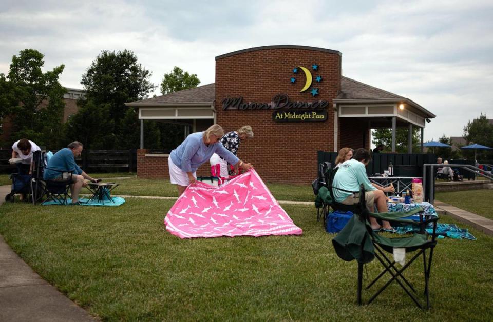 Kathleen Smith and Barbara Kok set up their blankets and chairs for the weekly Big Band and Jazz performance at the MoonDance Amphitheater in Lexington, Ky., on June 1, 2021.