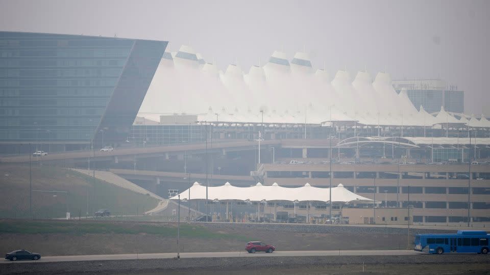 Heavy smoke shrouds a terminal at the Denver International Airport. - David Zalubowski/AP