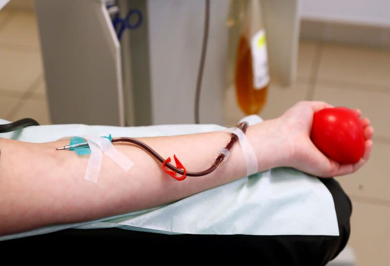 Lili Deneve, who has recovered from the coronavirus disease (COVID-19), donates plasma at the Belgian Red Cross blood collection center in Brussels