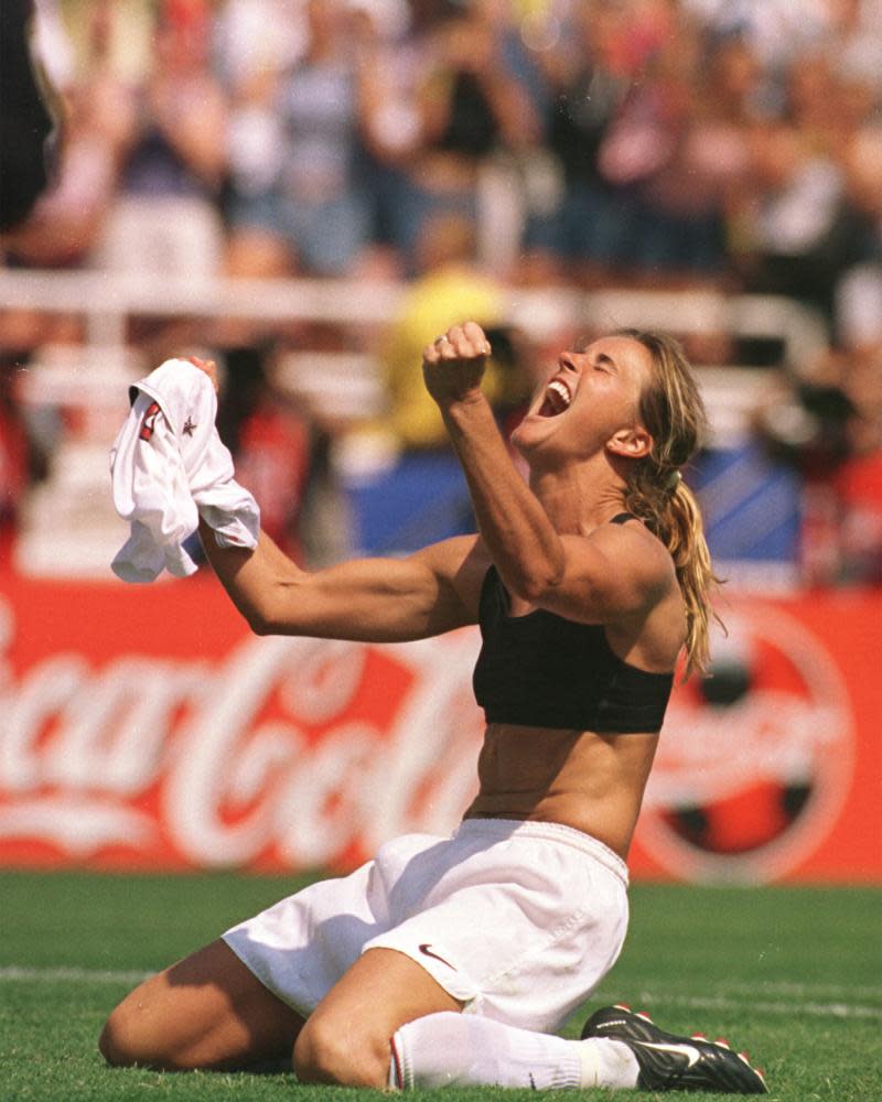 Brandi Chastain celebrates after scoring the game-winning penalty against China during the Women’s World Cup Final.
