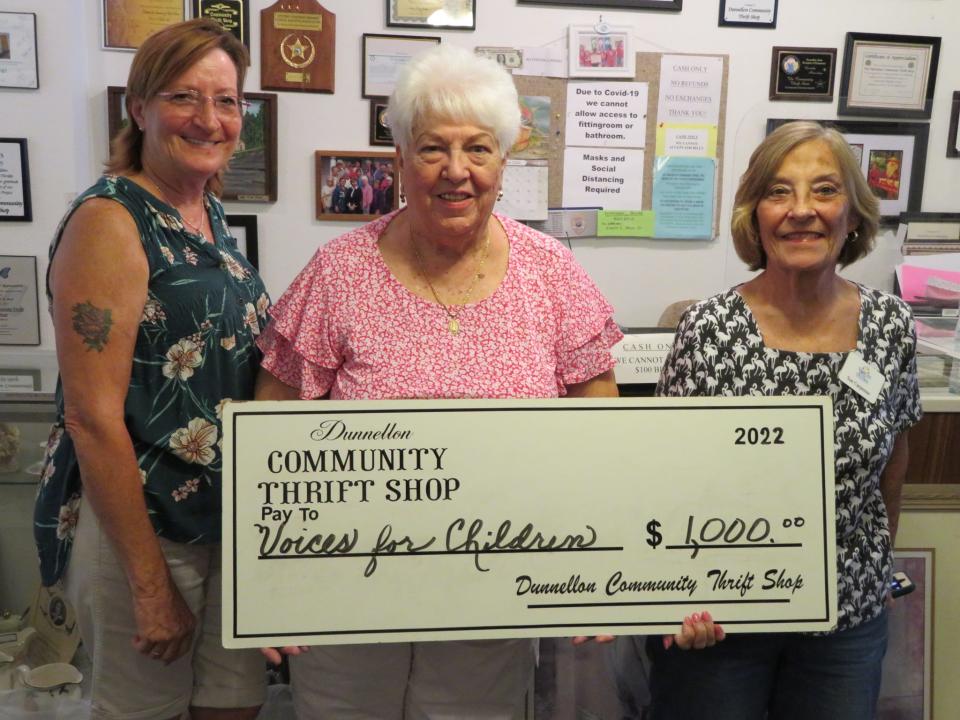 From left: Dunnellon Thrift Shop volunteers Jody Boyd and Barbara Maldanado present a $1,000 check to Sue Carpenter, the director of Voices for Children.