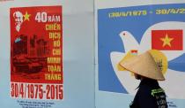 Propaganda posters displayed at an exhibition marking the 40th anniversary of the fall of Saigon, in downtown Ho Chi Minh City