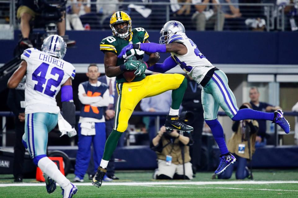 <p>Jared Cook #89 of the Green Bay Packers makes a catch while being defended by Morris Claiborne #24 of the Dallas Cowboys in the second half during the NFC Divisional Playoff Game at AT&T Stadium on January 15, 2017 in Arlington, Texas. (Photo by Joe Robbins/Getty Images) </p>