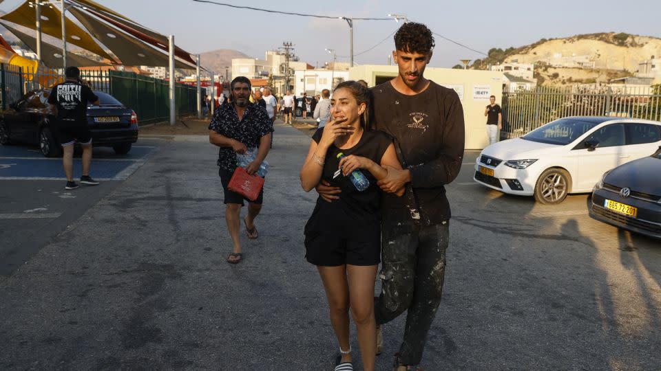 People are seen at the site of a rocket attack in Majdal Shams village on July 27, 2024. - Jalaa Marey/AFP/Getty Images