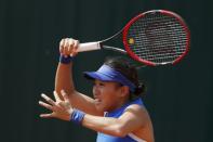 China's Zhang Shuai in action. REUTERS/Gonzalo Fuentes