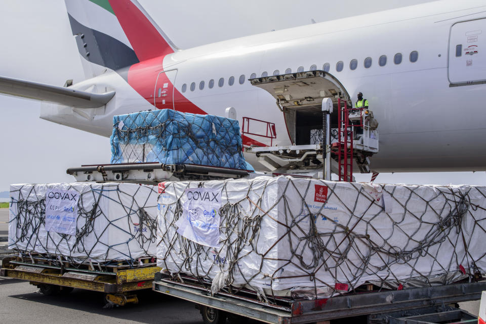 Uganda's first consignment of AstraZeneca COVID-19 vaccine manufactured by the Serum Institute of India and provided through the global COVAX initiative arrives at the airport in Entebbe, Uganda Friday, March 5, 2021. Urgent calls for COVID-19 vaccine fairness rang through African countries on Friday as more welcomed or rolled out doses from the global COVAX initiative, with officials acutely aware their continent needs much more. (AP Photo/Nicholas Bamulanzeki)