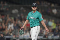 Seattle Mariners starting pitcher Marco Gonzales walks to the dugout after the top of the sixth inning of the team's baseball game against the Arizona Diamondbacks, Friday, Sept. 10, 2021, in Seattle. (AP Photo/Ted S. Warren)