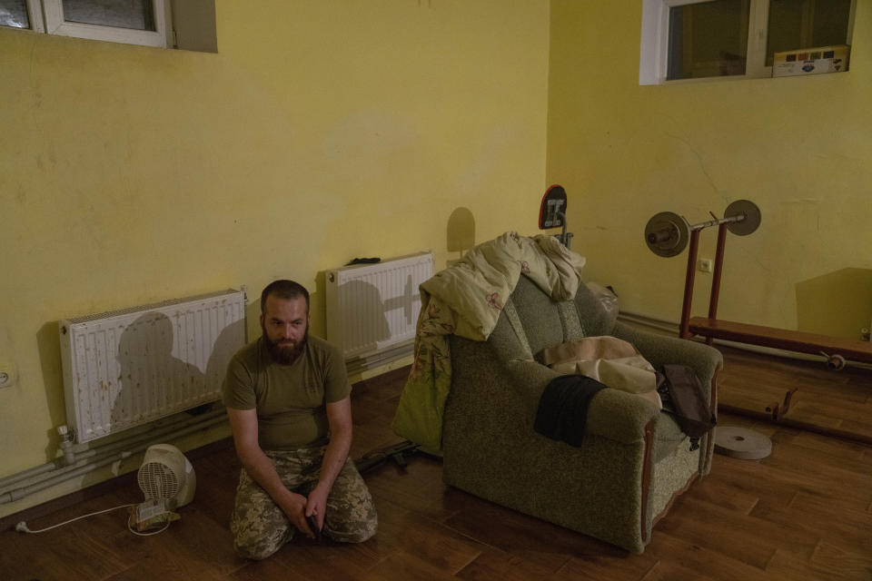 Ukrainian Muslim soldiers sit in a bomb shelter after hearing and feeling the effect of shelling near by, inside the Medina Mosque, Konstantinovka, eastern Ukraine, Saturday, July 9, 2022. (AP Photo/Nariman El-Mofty)