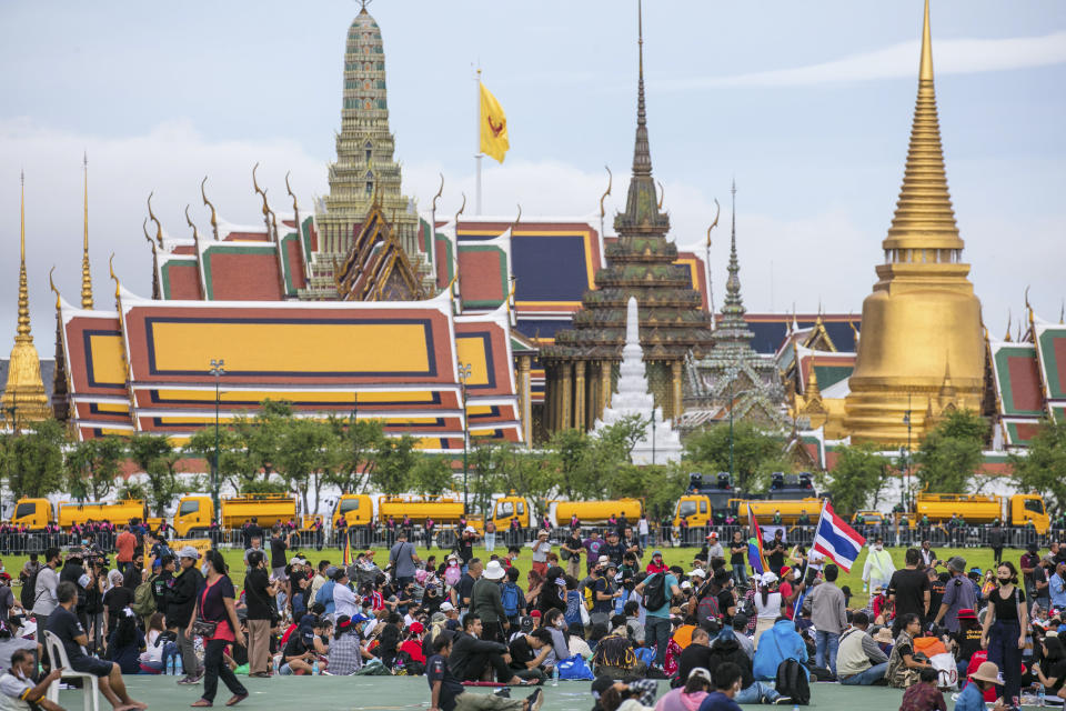 Pro-democracy protesters gather at the Sanam Luang field during a protest in Bangkok, Thailand, Sunday, Sept. 20, 2020. Thousands of demonstrators turned out Saturday for a rally to support the student-led protest movement's demands for new elections and reform of the monarchy. (AP Photo/Wason Wanichakorn)