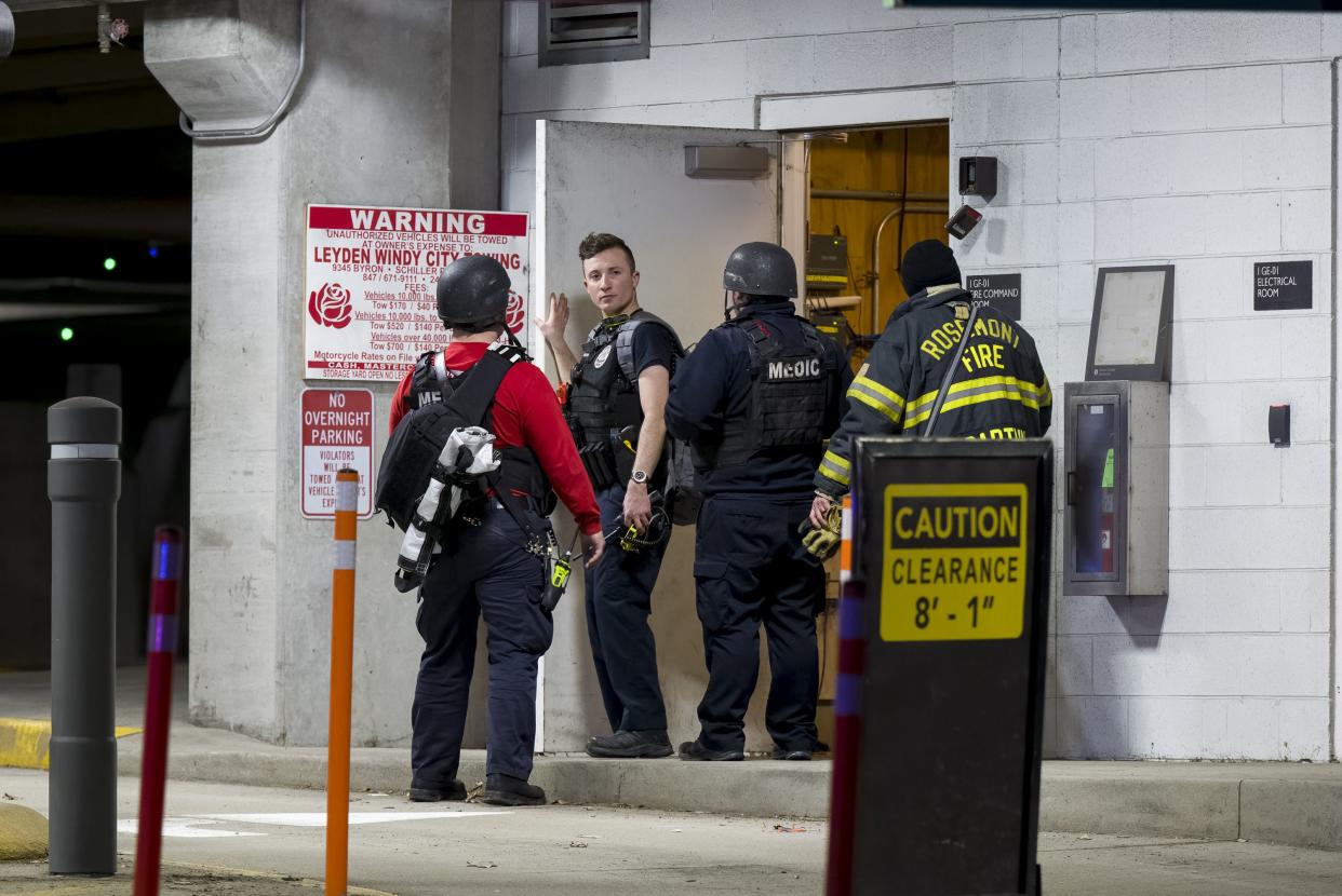 Police investigate a shooting at Fashion Outlets of Chicago on Friday night in Rosemont, Ill.