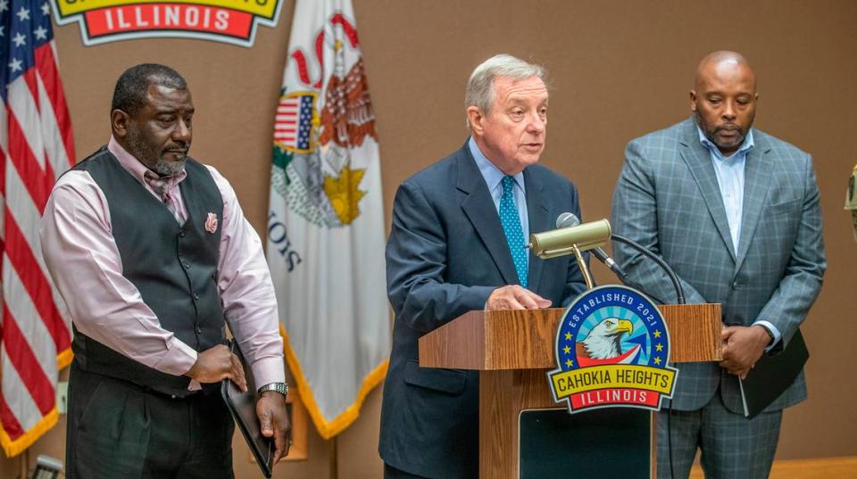 Cahokia Heights Mayor Curtis McCall Sr. and East St. Louis Mayor Robert Eastern III listen to U.S. Senator Richard Durbin address sewer and flooding issues that have plaqued their cities for years.