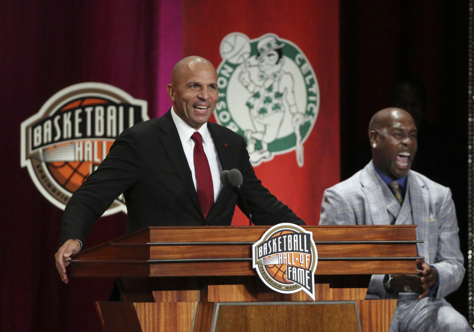 Jason Kidd, left, speaks as presenter Gary Payton, right, laughs during induction ceremonies into the Basketball Hall of Fame, Friday, Sept. 7, 2018, in Springfield, Mass. (AP Photo/Elise Amendola)