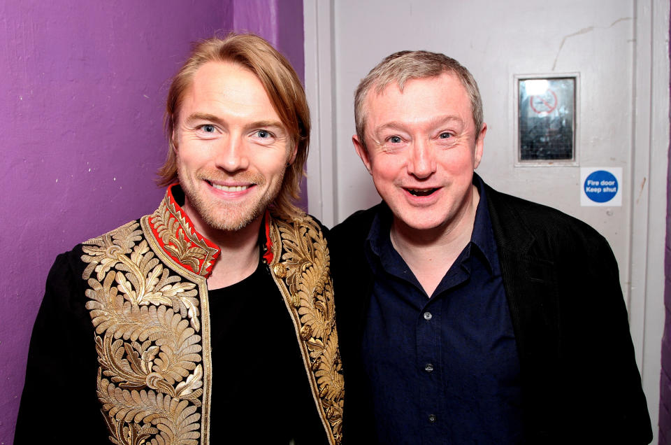 Boyzone member Ronan Keating (L) and Louis Walsh pose backstage prior to the band's pre-tour gig, their first show together in 8 years, at G.A.Y. on March 1, 2008 in London, England. The UK tour is set to start on May 5 in Belfast and the band will play the O2, London on May 30. (Photo by Dave Hogan/Getty Images)