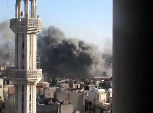 A YouTube image grab shows smoke billowing from the flashpoint Syrian city of Homs. A cessation of hostilities that officially started on April 12 has never held and massacres such as that in Houla on May 25 and Al-Kubeir last week have shocked international opinion