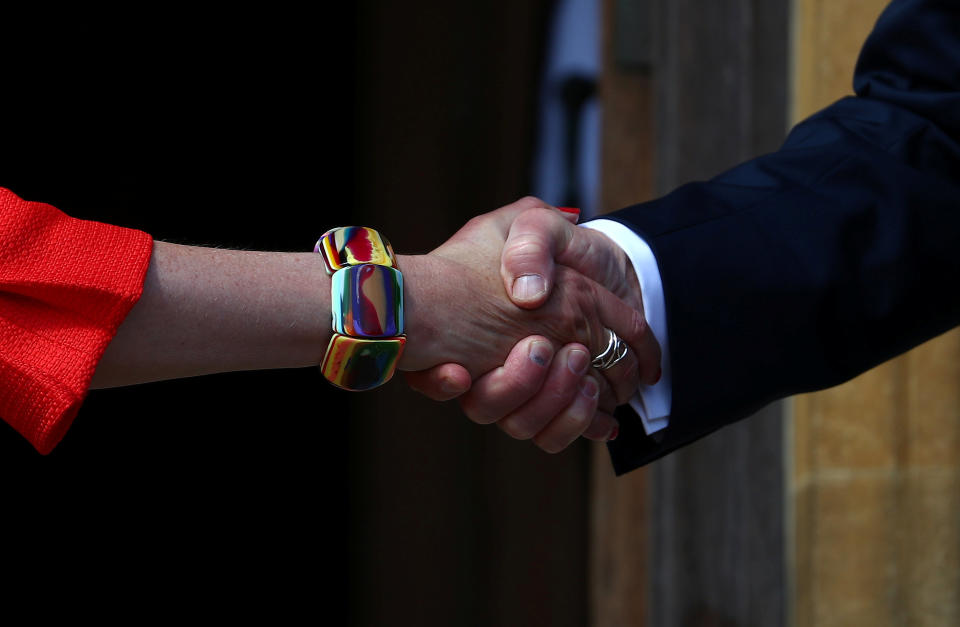 <p>Britain’s Prime Minister Theresa May greets President Donald Trump at Chequers near Aylesbury, Britain, July 13, 2018. (Photo: Hannah McKay/Reuters) </p>