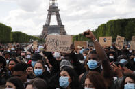 Hundreds of demonstrators gather on the Champs de Mars as the Eiffel Tower is seen in the background during a demonstration in Paris, France, Saturday, June 6, 2020, to protest against the recent killing of George Floyd, a black man who died in police custody in Minneapolis, U.S.A., after being restrained by police officers on May 25, 2020. Further protests are planned over the weekend in European cities, some defying restrictions imposed by authorities because of the coronavirus pandemic. (AP Photo/Francois Mori)