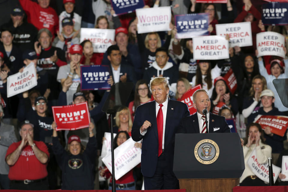 President Donald Trump listens as Rep. Jeff Van Drew, R-N.J., speaks at a campaign rally Tuesday, Jan. 28, 2020, in Wildwood, N.J. (AP Photo/Mel Evans)