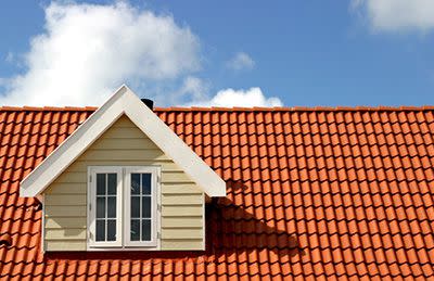 <p>CaraMaria / Getty Images</p> Spanish clay tile roof