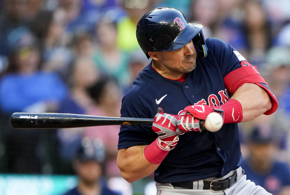 Boston Red Sox's Adam Duvall is hit by a pitch from Seattle Mariners starting pitcher Bryce Miller during the fourth inning of a baseball game, Tuesday, Aug. 1, 2023, in Seattle. (AP Photo/Lindsey Wasson)