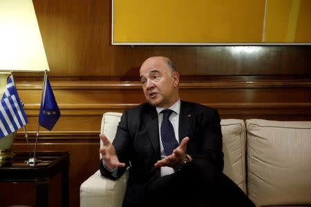 European Economic and Financial Affairs Commissioner Pierre Moscovici gestures during his meeting with Greek Prime Minister Alexis Tsipras (not pictured) at Maximos Mansion in Athens, Greece, July 25, 2017. REUTERS/Alkis Konstantinidis