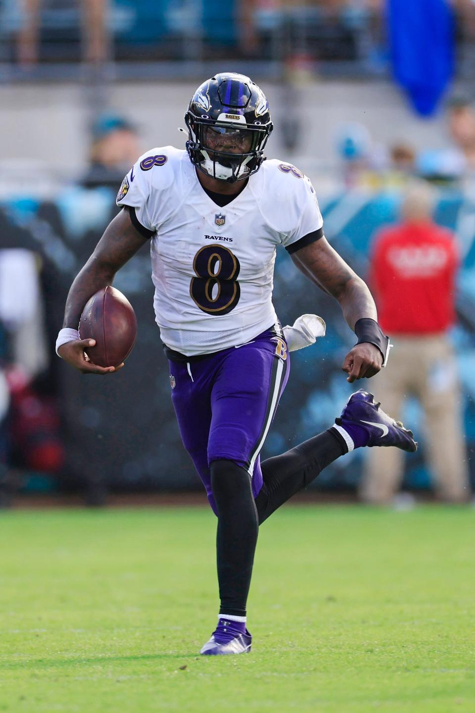 Baltimore Ravens quarterback Lamar Jackson (8) rushes for yards during the second quarter of a regular season NFL football matchup Sunday, Nov. 27, 2022 at TIAA Bank Field in Jacksonville. The Jaguars edged the Ravens 28-27. [Corey Perrine/Florida Times-Union]