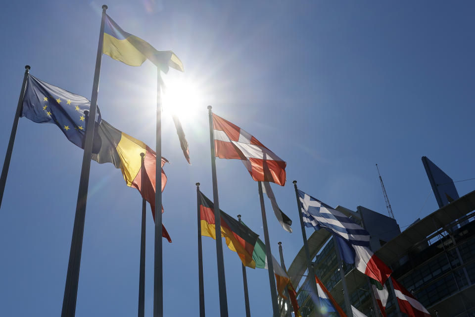 The Ukrainian flag, top, flies with others European flags outside the European Parliament , Tuesday, July 5, 2022 in Strasbourg, eastern France. (AP Photo/Jean-Francois Badias)