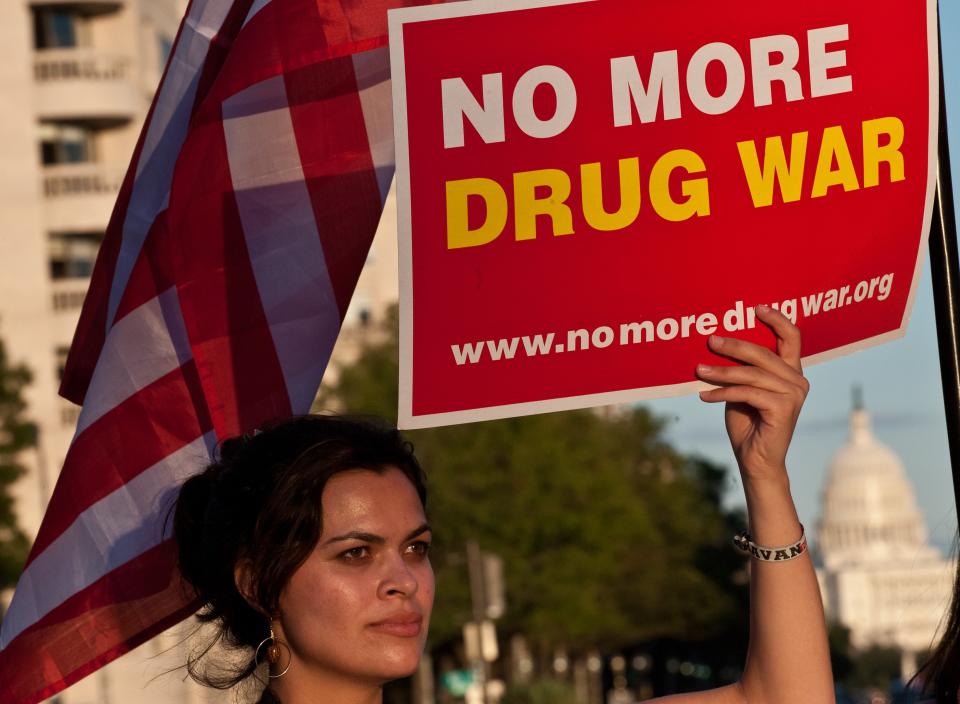 A woman holds a sign reading: No More Drug War. Ending the war on drugs was, many say, what Michael K. Williams supported before his fatal overdose in September.