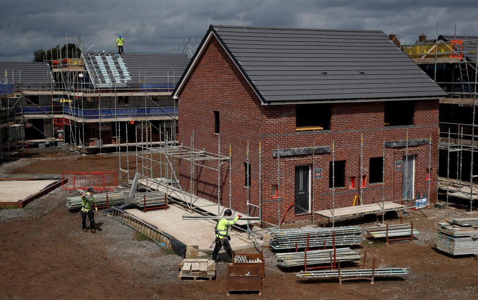 Builders work on a new Barratt Homes housing development near Warrington, Britain, August 6, 2020. REUTERS/Phil Noble
