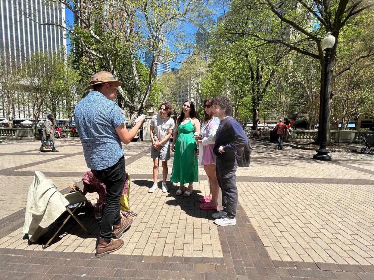 Marshall Kavanaugh reads his poem for students at the Curtis Institute of Music in Philadelphia. Singer Juliet Rand (green dress) said they appreciated the poetry because as musicians, "we work with poetry all the time." Kavanaugh's poem was met with cheers and bravos.