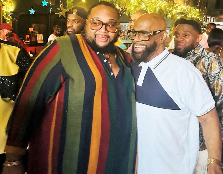 Joshua Jones, left, who brought the house down singing Patti LaBelle’s “You Are My Friend" at a community celebration honoring Ronnie Grace, poses for a photo with Grace.