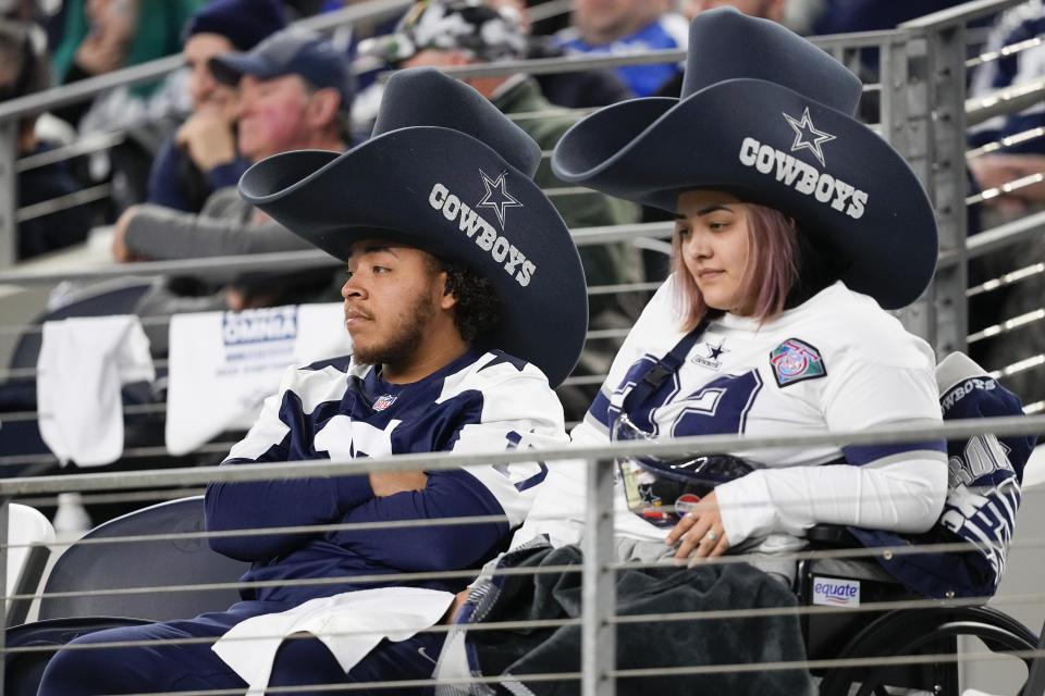 Dallas Cowboys supporters look on during the second half of an NFL football game against the Green Bay Packers, Sunday, Jan. 14, 2024, in Arlington, Texas. (AP Photo/Sam Hodde)