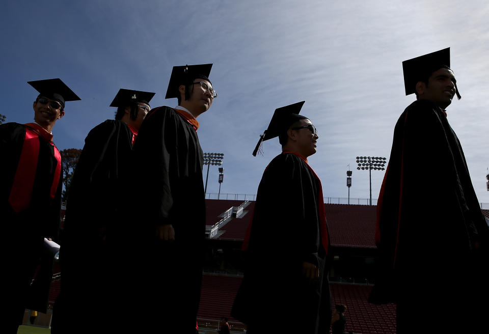 STANFORD, CA - JUNE 15: Graduating Stanford University students partcipate in the "Wacky Walk" before the start of the 123rd Stanford commencement ceremony June 15, 2014 in Stanford, California. Microsoft founder and chairman Bill Gates and wife Melinda Gates shared the stage to deliver the commencement speech to Stanford University graduates. (Photo by Justin Sullivan/Getty Images)