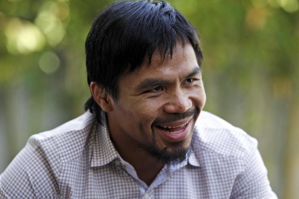 Boxer and politician Manny Pacquiao speaks about his views on same-sex marriage at his home in Los Angeles, Wednesday, May 16, 2012. Pacquiao was quoted in a recent interview as opposing President Barack Obama's views on same-sex marriage. (AP Photo/Reed Saxon)