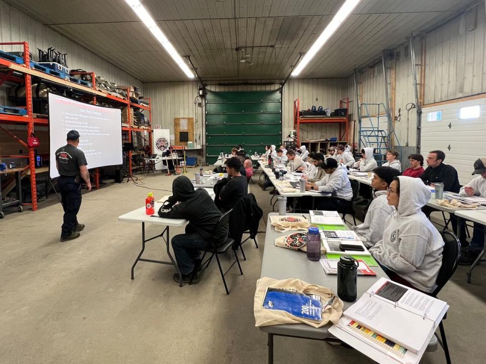 Students learning about hand tools and power pumps during Beat the Heat last week. 