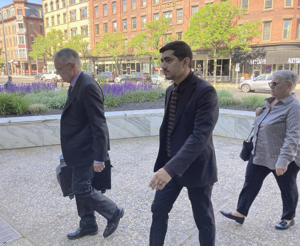 Michael DiMassa, right, and his lawyer, John Gulash, walk into federal court in Hartford, Conn., for DiMassa's sentencing on Wednesday, May 31, 2023. (AP Photo/David Collins)