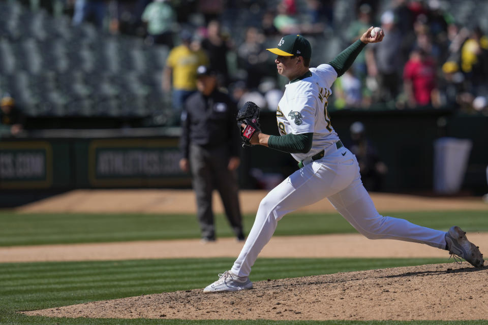 Oakland Athletics' Mason Miller pitches to a Washington Nationals batter during the ninth inning of a baseball game Sunday, April 14, 2024, in Oakland, Calif. (AP Photo/Godofredo A. Vásquez)