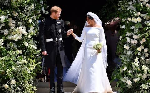 The new Duke and Duchess of Sussex leave St George's Chapel, Windsor on the wedding day - Credit: PA