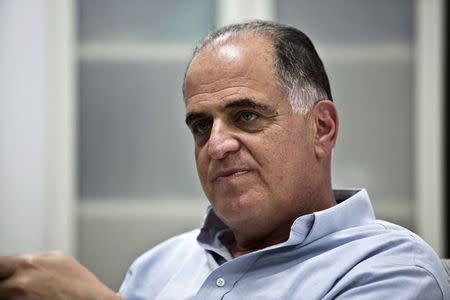 Israeli entrepreneur Avi Brenmiller sits at the control center of his new solar power company Brenmiller Energy near the southern town of Dimona in this September 9, 2014 file photo. REUTERS/Nir Elias/Files