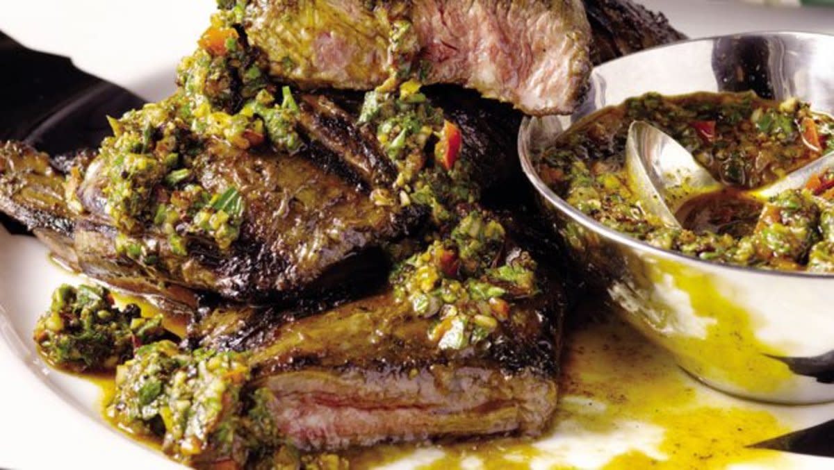 <p>Guy Fieri</p><p><strong>Get the recipe: <a href="/27006/guyfieri/gaucho-steak-chimichurri/" data-ylk="slk:Gaucho Steak With Four-Herb Chimichurri;elm:context_link;itc:0;sec:content-canvas" class="link rapid-noclick-resp">Gaucho Steak With Four-Herb Chimichurri</a></strong></p>