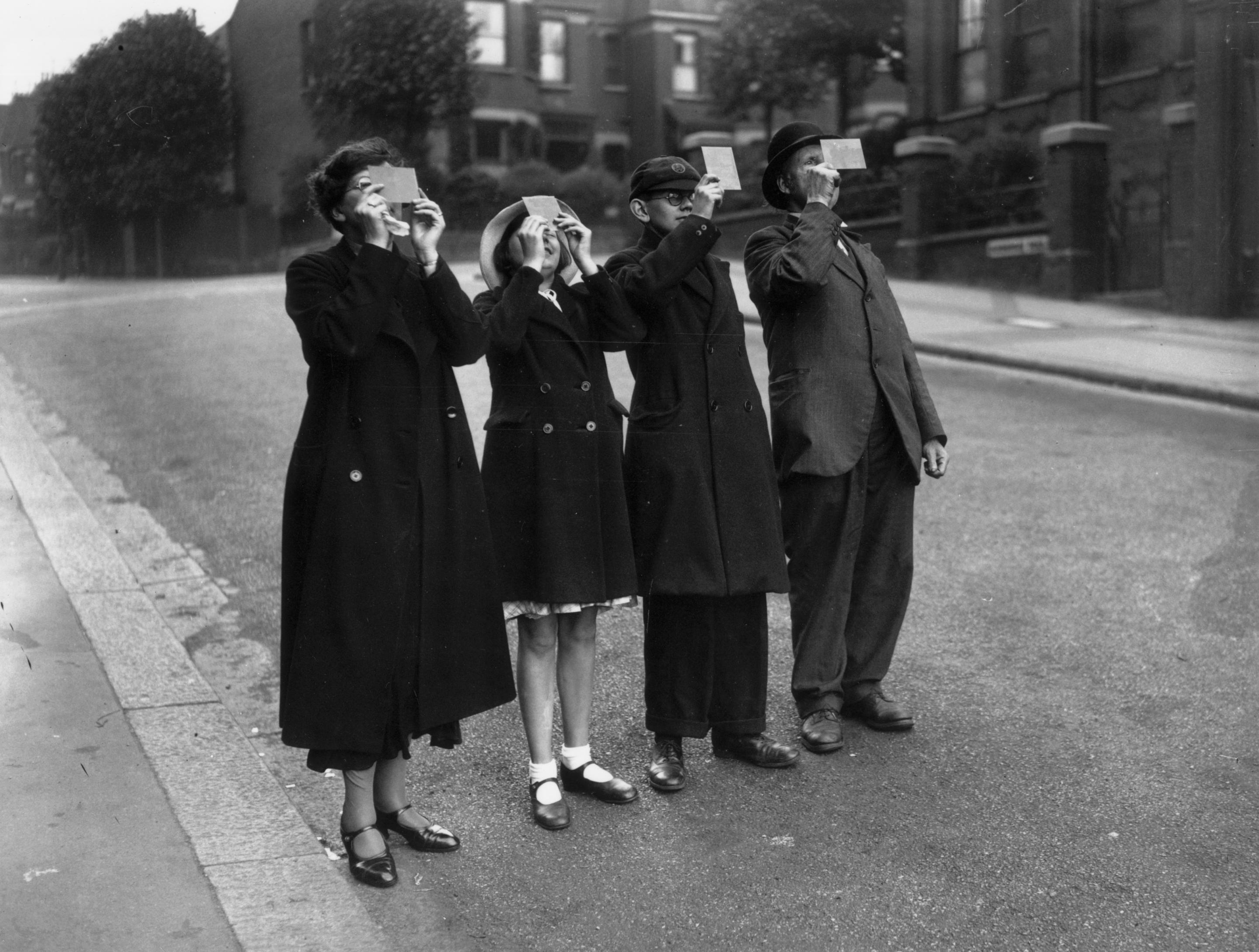 1936: People view an eclipse in London. 