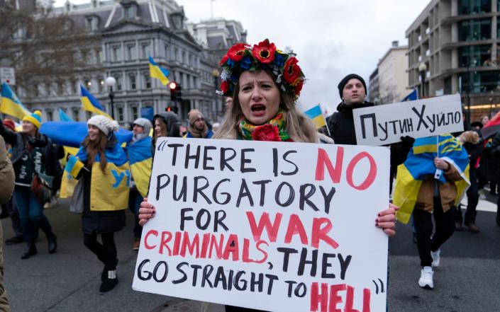 Demonstrators march in downtown in support of Ukraine during a rally in Washington, - Jose Luis Magana/AP