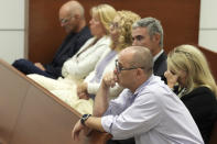 Fred Guttenberg is shown in the courtroom gallery with other family members of the victims as the defense moves for a mistrial during the penalty phase of the trial of Marjory Stoneman Douglas High School shooter Nikolas Cruz at the Broward County Courthouse in Fort Lauderdale, Fla., Thursday, Sept. 1, 2022. Guttenberg's daughter, Jaime, was killed in the 2018 shootings. Cruz previously plead guilty to all 17 counts of premeditated murder and 17 counts of attempted murder in the 2018 shootings. (Amy Beth Bennett/South Florida Sun Sentinel via AP, Pool)
