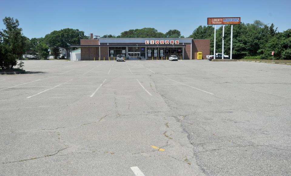 A plan for a 99-room hotel and 50 apartments at the Liberty Liquors property in Buzzards Bay, photographed on Monday, was presented June 25 to the Bourne Board of Sewer Commissioners.