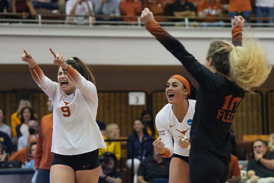 Texas' Saige Ka'aha'aina-Torres, left, and Keonilei Akana cheer during the Longhorns' Sweet 16 win over Marquette. Akana's service ace on match point delivered Texas its NCAA championship Saturday night against Louisville.