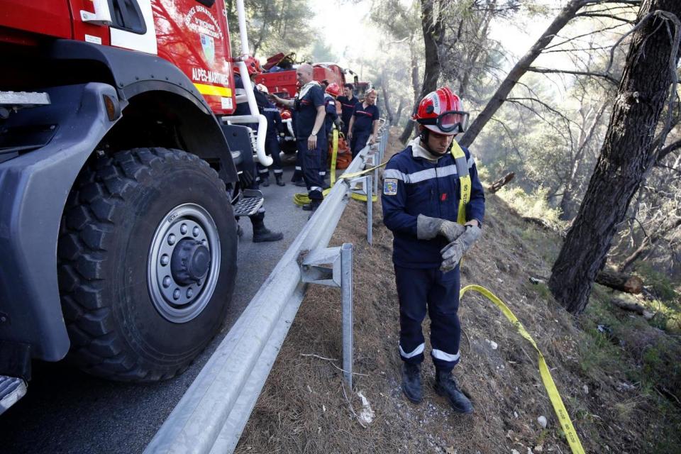 Firefighters prepare to fight a forest fire in Carros near Nice, southern France (EPA)