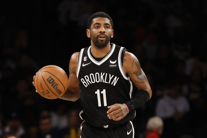 NEW YORK, NEW YORK - JANUARY 30: Kyrie Irving #11 of the Brooklyn Nets dribbles during the second half against the Los Angeles Lakers at Barclays Center on January 30, 2023 in the Brooklyn borough of New York City. The Nets won 121-104. NOTE TO USER: User expressly acknowledges and agrees that, by downloading and/or using this photograph, User is consenting to the terms and conditions of the Getty Images License Agreement. (Photo by Sarah Stier/Getty Images)